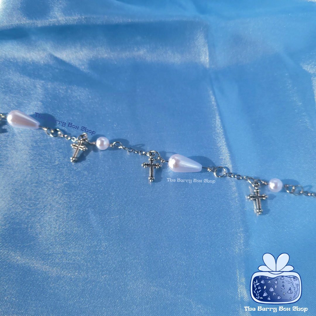 Pearl and cross charm bracelet