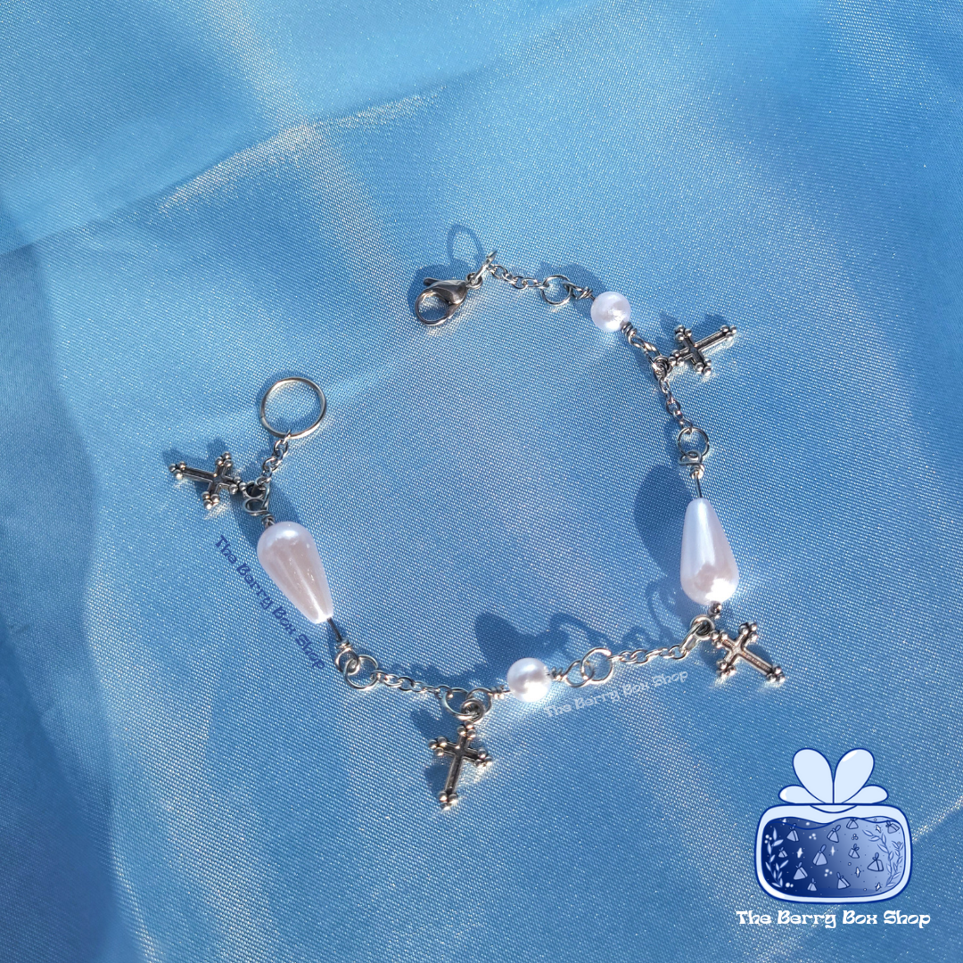 Pearl and cross charm bracelet